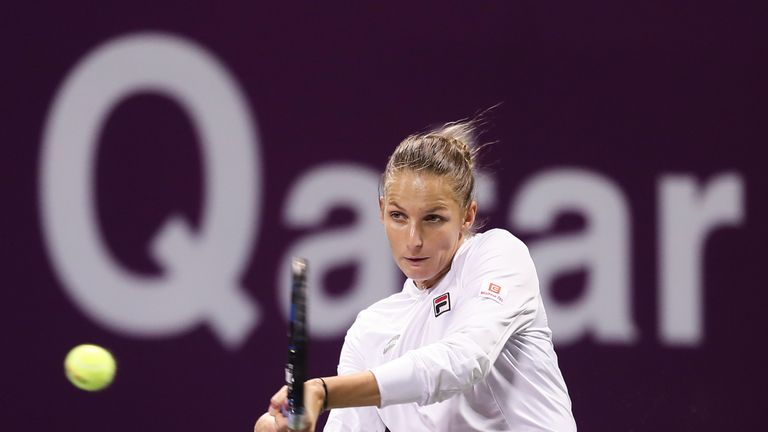 Karolina Pliskova of the Czech Republic returns a ball to Dominika Cibulkova of Slovakia during their semi-final tennis match at the WTA Qatar Total Open i