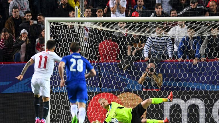 SEVILLE, ENGLAND - FEBRUARY 22:  Kasper Schmeichel of Leicester City saves a penalty from Joaquin Correa of Sevilla during the UEFA Champions League Round 