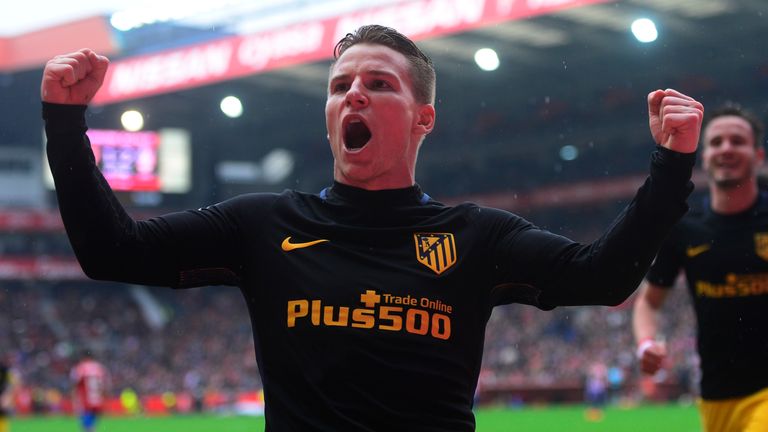 Atletico Madrid's French forward Kevin Gameiro celebrates after scoring a goal during the Spanish league football match Real Sporting de Gijon vs Club Atle