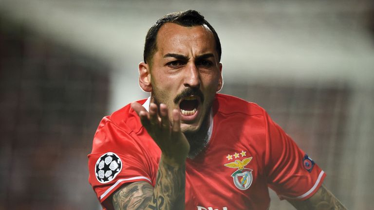 Benfica's Greek forward Konstantinos Mitroglou celebrates after scoring during the UEFA Champions League round of 16 first leg football match SL Benfica vs