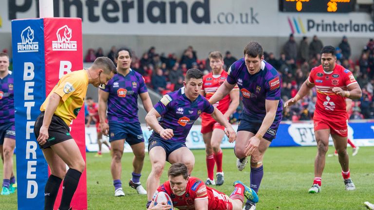Salford's Kriss Brining scores a try against Wigan