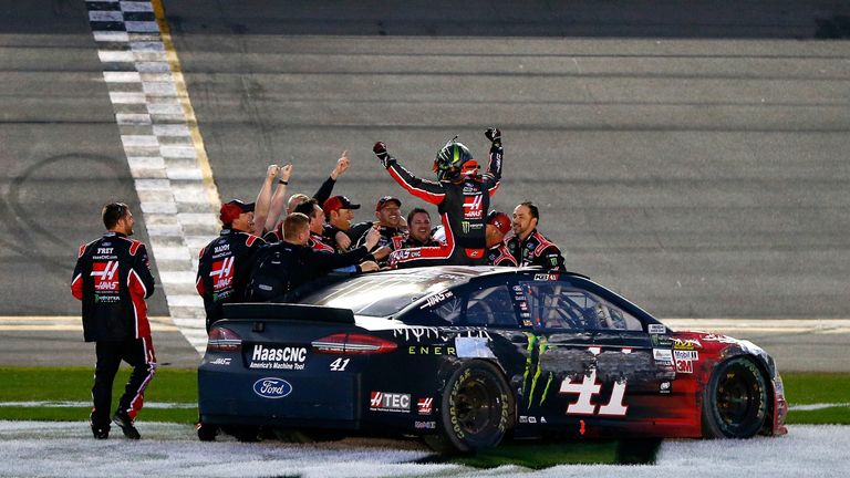 DAYTONA BEACH, FL - FEBRUARY 26:  Kurt Busch, driver of the #41 Haas Automation/Monster Energy Ford, celebrates with his crew after winning the 59th Annual