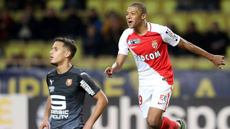 Monaco's French forward Kylian Mbappe Lottin (R) celebrates after scoring a goal during a French League Cup football match between Monaco (ASM) and Rennes 