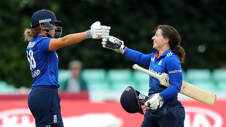 Beaumont of England (r) is congratulated by Lauren Winfield as she reaches her century during the second  ODI match  Pakistan at New Road on June 22