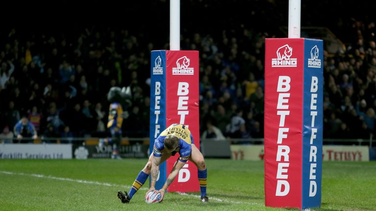 Leeds Rhinos Liam Sutcliffe touches the ball down after running in the winning try during the Super League match at Headingley Stadium, Leeds.