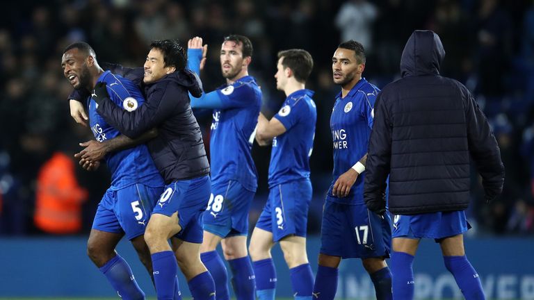 LEICESTER, ENGLAND - FEBRUARY 27:  Wes Morgan of Leicester City (L) celebrates with team mates  after the full time whistle during the Premier League match
