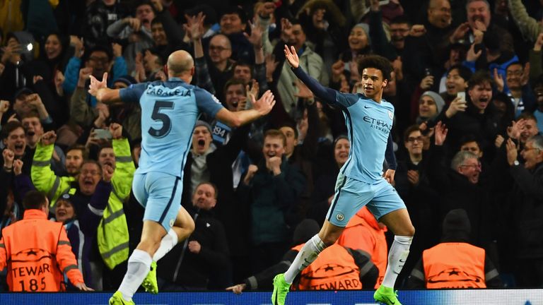 Leroy Sane of Manchester City (R) celebrates as he scores their fifth goal 