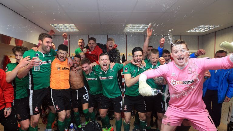 BURNLEY, ENGLAND - FEBRUARY 18:   The Lincoln City team celebrate their win in the changing room after The Emirates FA Cup Fifth Round match between Burnle