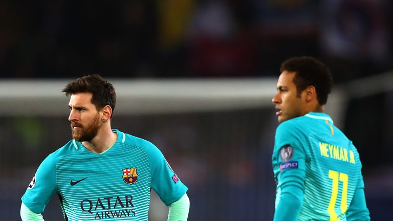  Lionel Messi and Neymar of Barcelona look on during the UEFA Champions League Round of 16 first leg match between Paris Saint-Germain