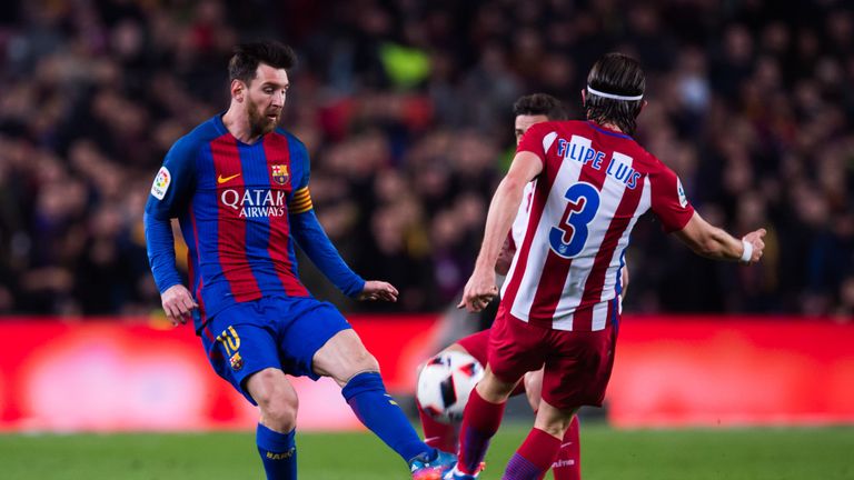 BARCELONA, SPAIN - FEBRUARY 07: Lionel Messi (L) of FC Barcelona fights for the ball with Filipe Luis ot Atletico de Madrid during the Copa del Rey semi-fi