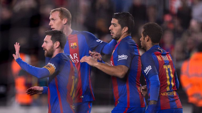 Barcelona's Argentinian forward Lionel Messi (L) is congratulated by teammates Barcelona's French defender Jeremy Mathieu (2L) and Barcelona's Uruguayan fo