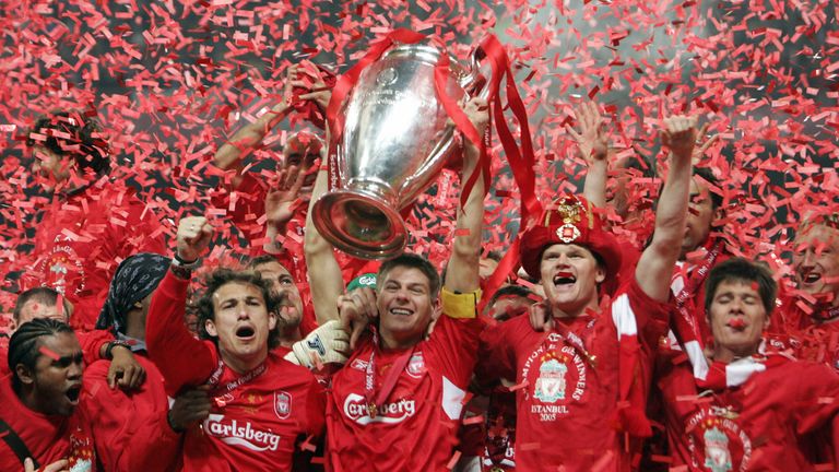 Liverpool's captain Steven Gerrard holds the throphy surrounded by teammates at the end of the UEFA Champions league football final