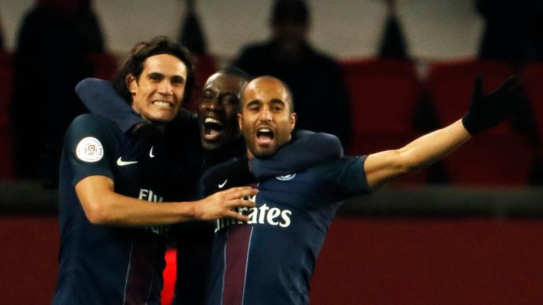 Lucas Moura (right) celebrates with team-mates after scoring PSG's late winner against Lille