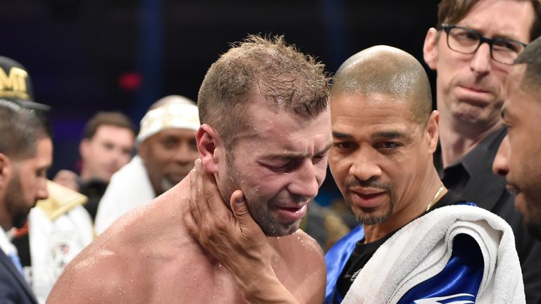 Lucian Bute of Canada (L) reacts following his WBC Super Middleweight Championship boxing match with Jack Badou of Sweden in Washington, DC, May 1, 2016. T