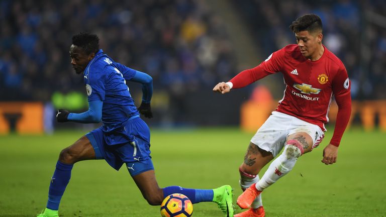 LEICESTER, ENGLAND - FEBRUARY 05:  Marcos Rojo of Manchester United and Ahmed Musa of Leicester City battle for the ball during the Premier League match be