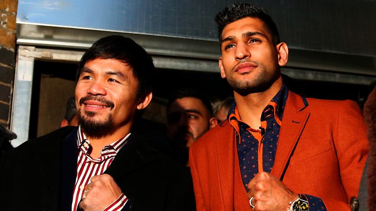 LONDON, ENGLAND - JANUARY 23:  Manny Pacquiao and Amir Khan pose after holding discussions about the possibility of a future fight, at Fitzroy Lodge Amateu