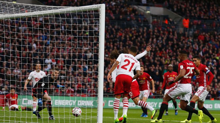 Southampton's Italian striker Manolo Gabbiadini (C) slots the ball past Manchester United's Spanish goalkeeper David de Gea but the goal is disallowed for 