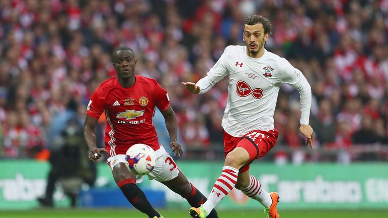 Manolo Gabbiadini takes on Eric Bailly during the first-half of the EFL Cup Final at Wembley