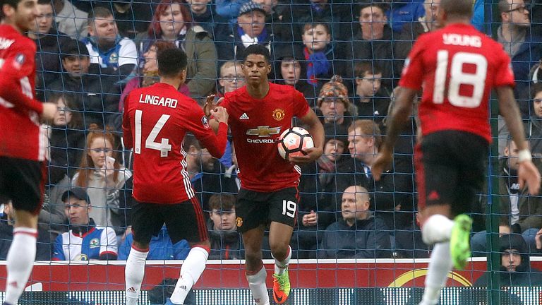 Manchester United's Marcus Rashford celebrates scoring his side's first goal of the game during the Emirates FA Cup, Fifth Round match at Ewood Park, Black