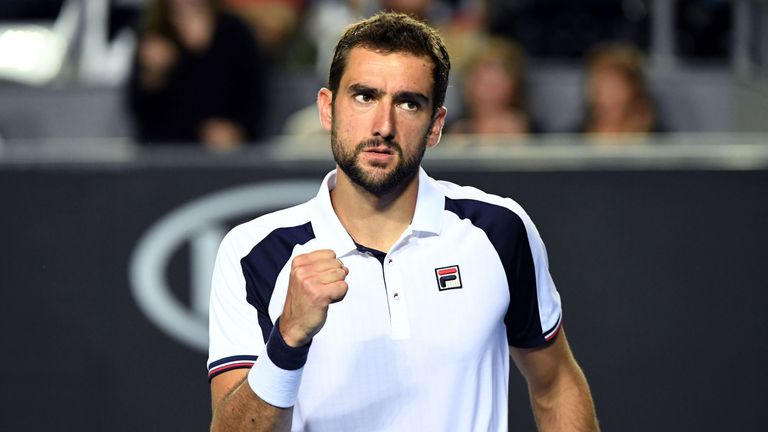 Croatia's Marin Cilic reacts after a point against Britain's Daniel Evans during their men's singles match on day three of the Australian Open