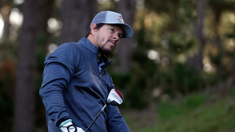 PEBBLE BEACH, CA - FEBRUARY 11:  Mark Wahlberg watches his tee shot on the second hole during the first round of the AT&T Pebble Beach National Pro-Am at t