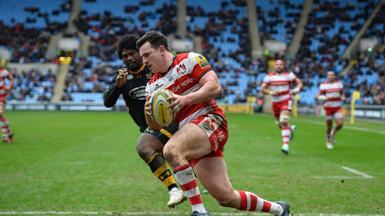 Matt Scott  of Gloucester runs in to score a try against Wasps