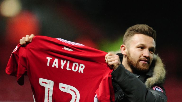 New Bristol City signing Matty Taylor poses with his shirt at half time v Sheffield Wednesday after being unveiled to his new fans
