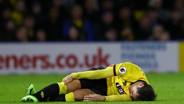 WATFORD, ENGLAND - FEBRUARY 25:  An injured Mauro Zarate of Watford lays on the turf during the Premier League match between Watford and West Ham United at