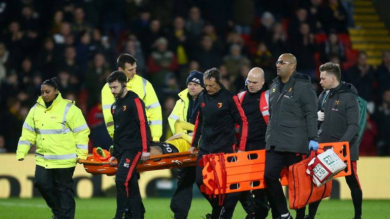 WATFORD, ENGLAND - FEBRUARY 25:  An injured Mauro Zarate of Watford is stretchered off during the Premier League match between Watford and West Ham United 