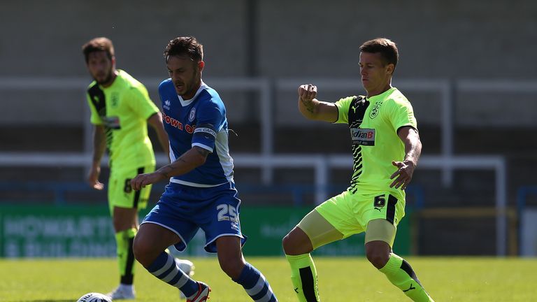 Michael Rose (L)  earned a point for Morecambe