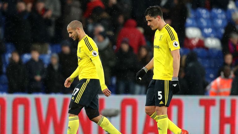 LONDON, ENGLAND - FEBRUARY 25: Adlene Guedioura of Middlesbrough (L) and Bernardo Espinosa of Middlesbrough (R) walk off dejected after the Premier League 