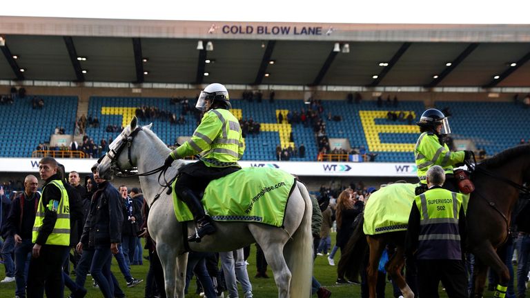 LONDON, ENGLAND - FEBRUARY 18:  Police on horseback take control of the pitch invaders after The Emirates FA Cup Fifth Round match between Millwall and Lei