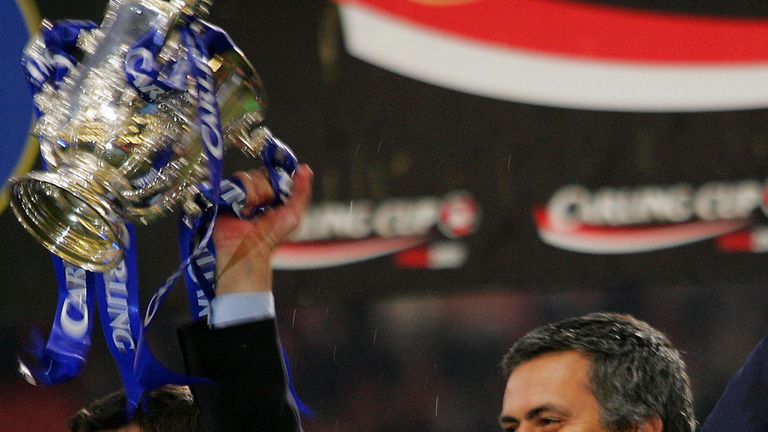 CARDIFF, United Kingdom:  Chelsea's manager Jose Mourinho raises the Carling Cup trophy after defeating Liverpool in ther Carling Cup Final football match 