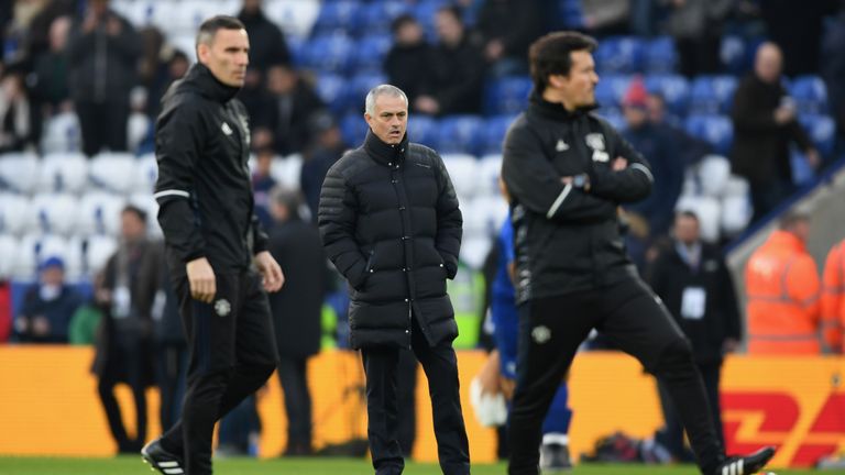 LEICESTER, ENGLAND - FEBRUARY 05:  Jose Mourinho manager of Manchester United (C) watches platers warm up prior to the Premier League match between Leicest