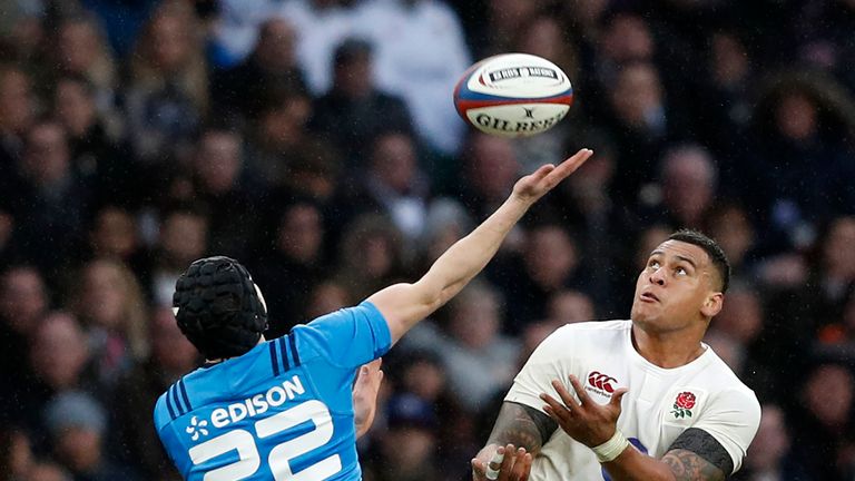 England's number 8 Nathan Hughes compete for a high ball