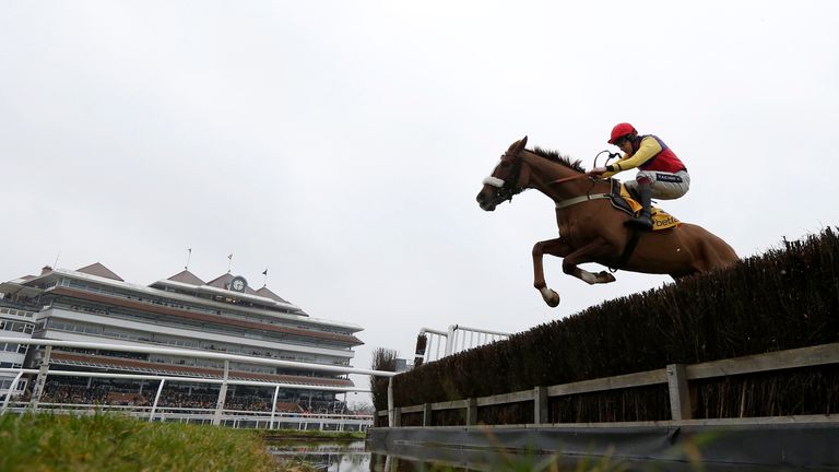 Aidan Coleman and Native River clear the water jump on their way to winning the Betfair Denman Chase at Newbury.