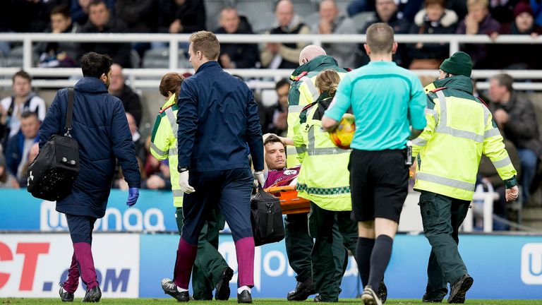 Scott Hogan leaves the pitch on a stretcher after suffering an injury during the Championship match at St James' Park