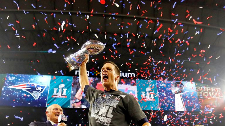 Tom Brady #12 of the New England Patriots celebrates with the Vince Lombardi Trophy after defeating the Atlanta Falcons