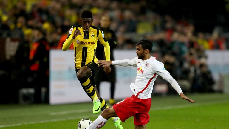 Borussia Dortmund's Ousmane Dembele skips past a RB Leipzig challenge
