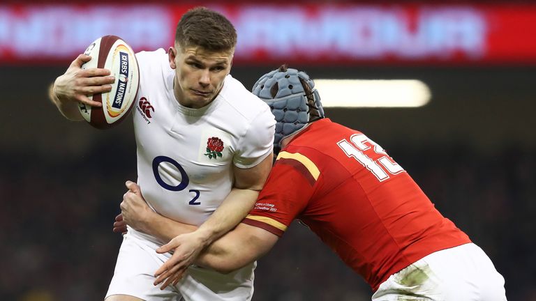 Owen Farrell is tackled by Jonathan Davies during their Six Nations match at the Principality Stadium