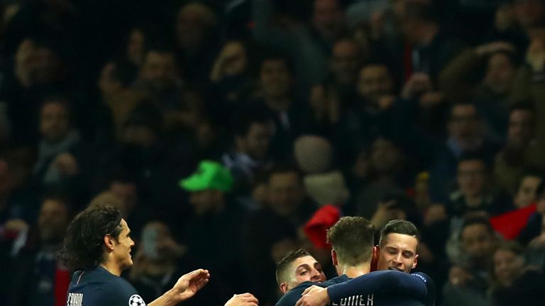 PARIS, FRANCE - FEBRUARY 14:  Julian Draxler of Paris Saint-Germain celebrates with team-mates after scoring his team's second goal during the UEFA Champio