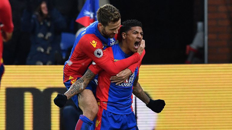 Crystal Palace's Dutch defender Patrick van Aanholt (R) celebrates scoring his team's first goal during the English Premier League football match between C