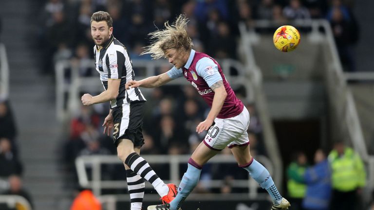 Paul Dummett and Birkir Bjarnason go up for a header