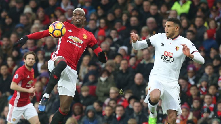 Paul Pogba competes with Etienne Capoue during the Premier League clash between Manchester United and Watford