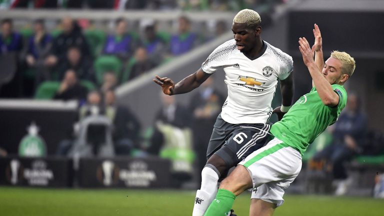 Jordan Veretout vies for possession with Paul Pogba at the Geoffroy Guichard stadium