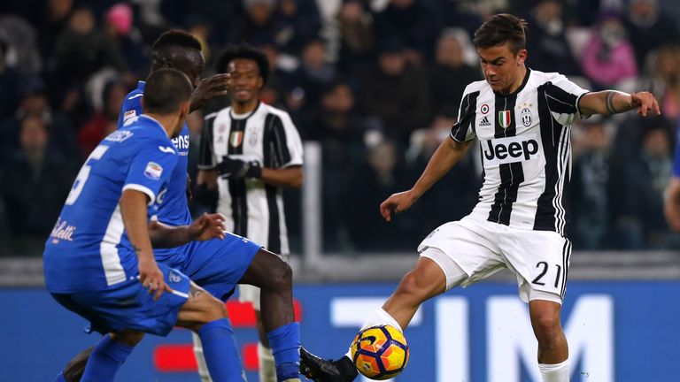 Juventus' forward Paulo Dybala from Argentina (R) fights for the ball with Empoli's midfielder Assane Diousse of Senegal (L) during the Italian Serie A foo