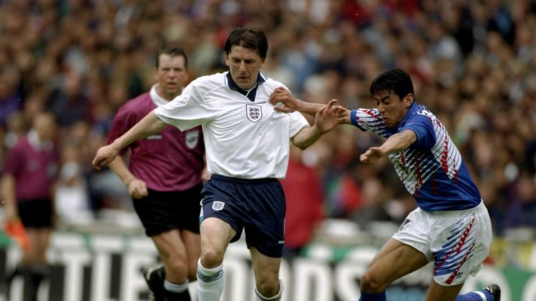 1 Jan 1995:  Peter Beardsley of England holds off a tackle by Masami Ihara of Japan during an Umbro Cup match against Japan at Wembley Stadium in London. E