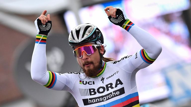 Slovakian cyclist Peter Sagan of Bora-Hansgrohe celebrates as he crosses the finish line to win the 69th edition of the Kuurne-Brussels-Kuurne one-day cycl