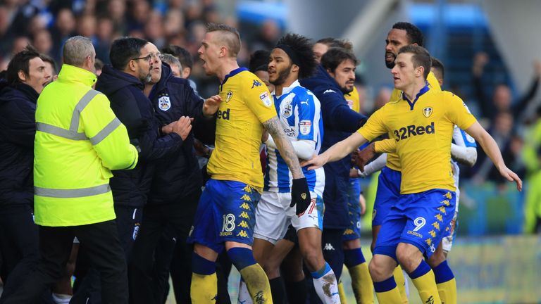 Tempers flare on the touchline as Huddersfield Town manager David Wagner (left) and Leeds United's Pontus Jansson (centre) confront each other 