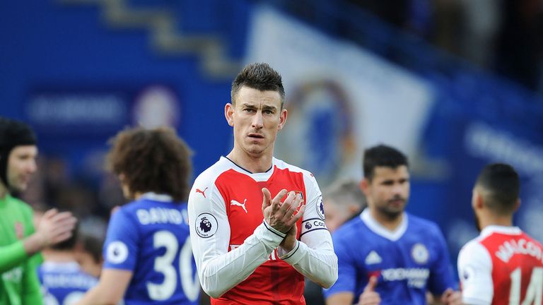 Laurent Koscielny applauds the Arsenal fans after the 3-1 defeat by Chelsea at Stamford Bridge